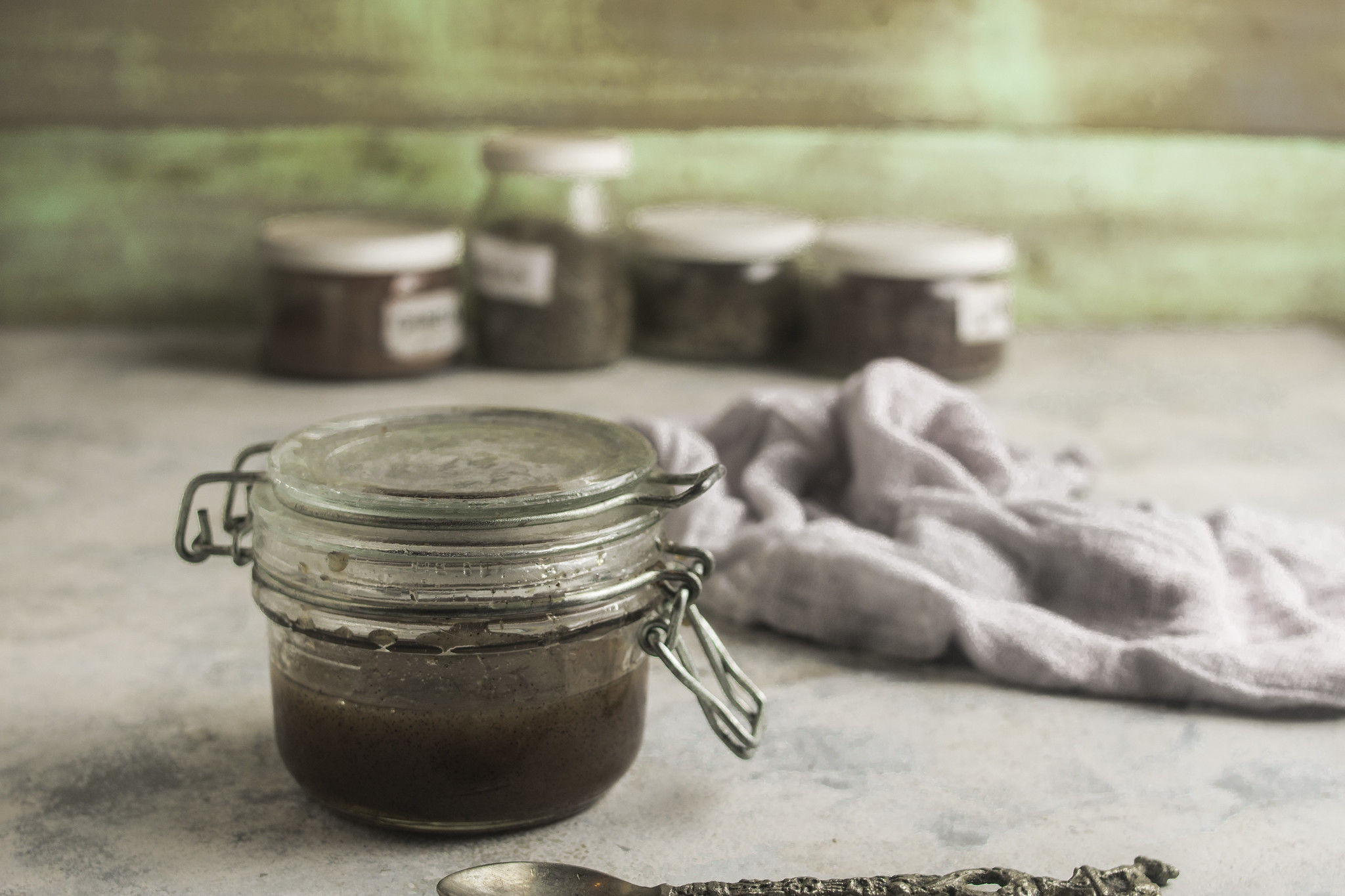 Homemade vanilla bean paste in a sealed glass jar